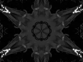 Black silver metalic kaleidoscope background. Abstract and symmetric pattern with dark vibes. photo