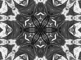 Black silver metalic kaleidoscope background. Abstract and symmetric pattern with dark vibes. photo