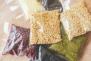 Cereal beans legumes peas lentils in package product dry food with sesame soybean black eye pea mung and red bean , non perishable food photo