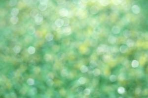 Nature green light circle bokeh abstract background with space for design. photo