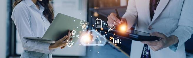 man use Laptop with cloud computing diagram show on hand. Cloud technology. Data storage. Networking and internet service concept. photo