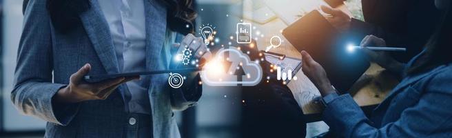 man use Laptop with cloud computing diagram show on hand. Cloud technology. Data storage. Networking and internet service concept. photo
