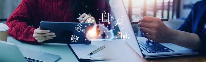 man use Laptop with cloud computing diagram show on hand. Cloud technology. Data storage. Networking and internet service concept. photo