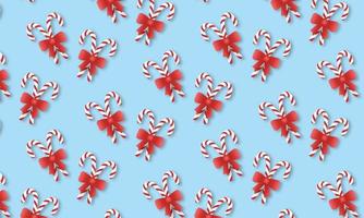 Repeating pattern of candy canes on a blue background photo