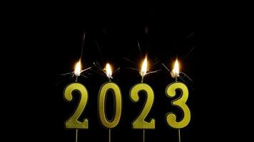 Numbers of the year 2023 made by gold sparkler candle number  isolated on black background photo