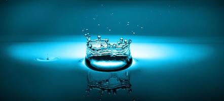 splash of water on a blue background photo