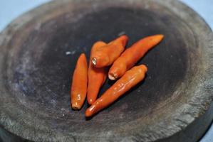 Spicy Red chili with cutting board background photo