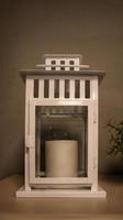 Unique white candle holder or housing for room decoration. photo