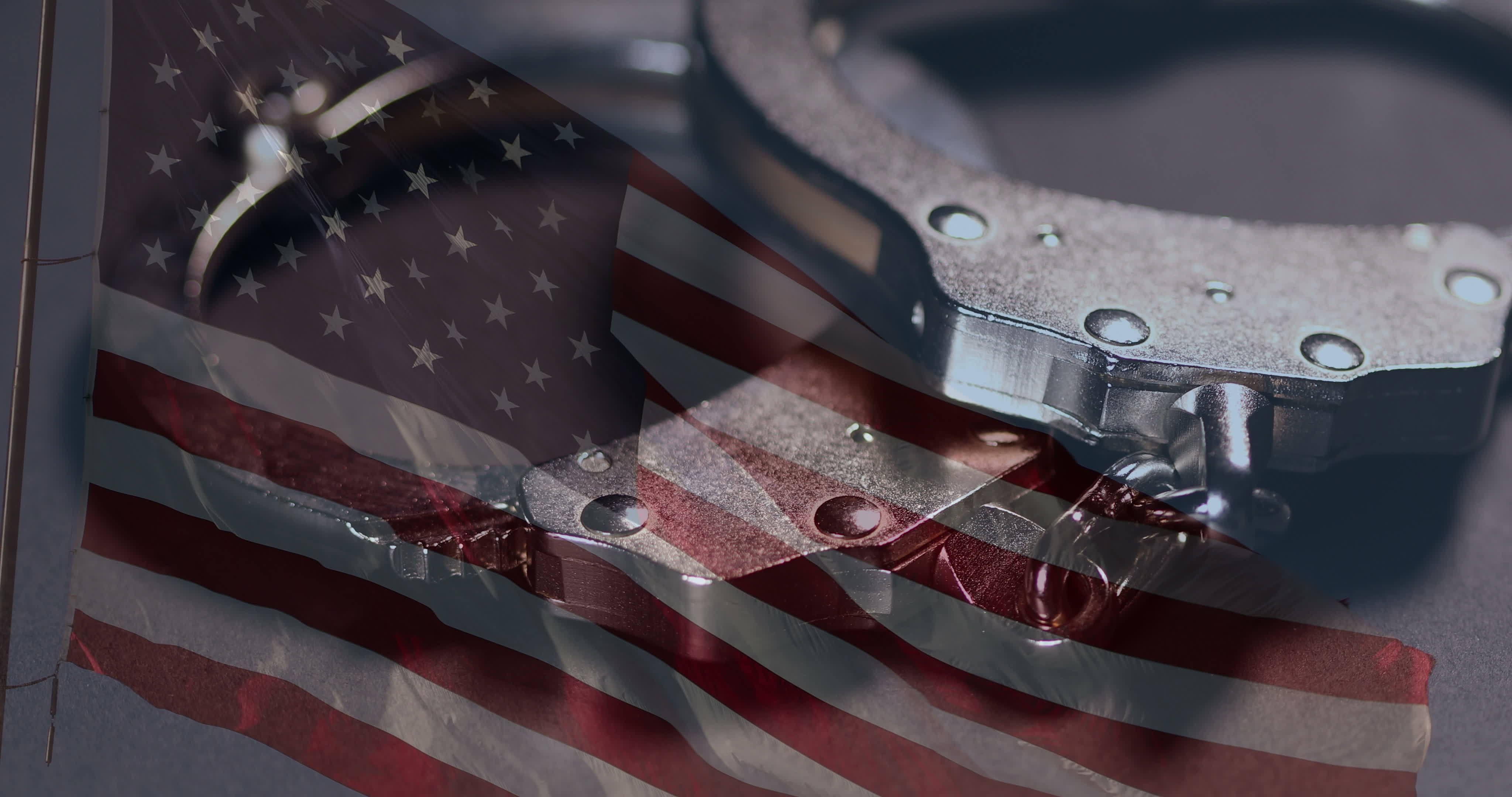 Handcuffs Rotation Closeup and Ghosted American Flag On Dark Background