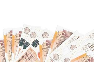 10 British pounds bills lies on bottom side of screen isolated on white background with copy space. Background banner template photo