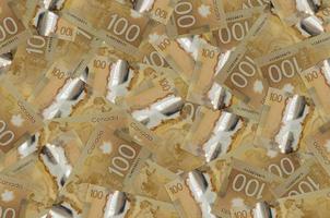 Los billetes de 100 dólares canadienses se encuentran en una gran pila. fondo conceptual de vida rica