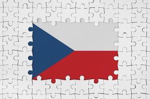 Czech flag in frame of white puzzle pieces with missing central part photo