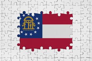 Georgia US state flag in frame of white puzzle pieces with missing central part photo