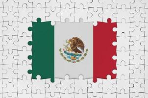 Mexico flag in frame of white puzzle pieces with missing central part photo