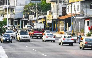 Puerto Escondido Oaxaca Mexico 2022 Busy road street driving cars traffic jam Puerto Escondido Mexico. photo