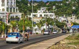 Puerto Escondido Oaxaca Mexico 2022 Busy road street driving cars traffic jam Puerto Escondido Mexico. photo