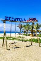 Puerto Escondido Oaxaca Mexico 2022 Romantic paradise swing on the beach in Puerto Escondido Mexico. photo