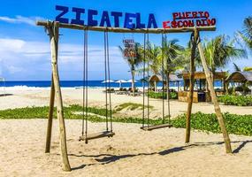 Puerto Escondido Oaxaca Mexico 2022 Romantic paradise swing on the beach in Puerto Escondido Mexico. photo