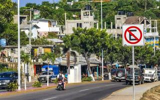 Puerto Escondido Oaxaca Mexico 2022 Busy road street driving cars traffic jam Puerto Escondido Mexico. photo