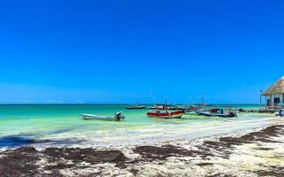 Holbox Quintana Roo Mexico 2022 Beautiful Holbox island beach with boat and turquoise water Mexico. photo