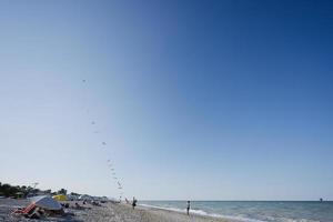 Kite seller in beach Porto Sant Elpidio, Italy. photo