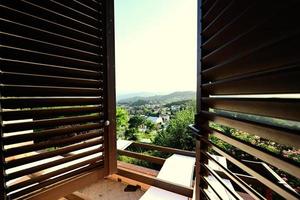 View from window with blinds of house in Nocera Umbra,  town and comune in the province of Perugia, Italy. photo