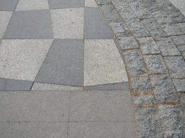 Drawing tiles on the pavement. Stone street surface. Masonry. photo