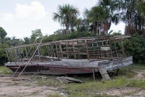 Abandon old wooden boat once used for transporting people and goods up and down the Rivers of the Amazon in Brazil photo