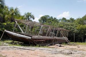 Abandon old wooden boat once used for transporting people and goods up and down the Rivers of the Amazon in Brazil photo