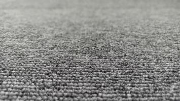 Gray fiber textured carpet background photo