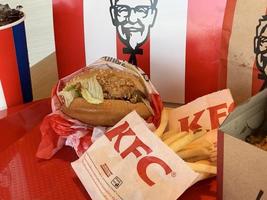 Ayutthaya,Thailand - Apr 06,2022- KFC Hamburger and Fried Chicken set at fast food restaurant Kentucky Fried Chicken KFC is a large restaurant chain. At Big C, Wangnoi branch in Thailand - Asia. photo