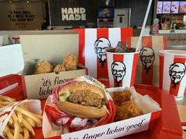Ayutthaya,Thailand - Apr 06,2022- KFC Hamburger and Fried Chicken set at fast food restaurant Kentucky Fried Chicken KFC is a large restaurant chain. At Big C, Wangnoi branch in Thailand - Asia. photo