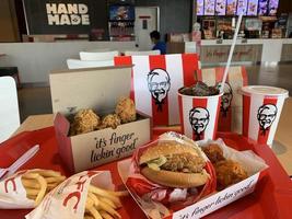 Ayutthaya,Thailand - Apr 06,2022- KFC Hamburger and Fried Chicken set at fast food restaurant Kentucky Fried Chicken KFC is a large restaurant chain. At Big C, Wangnoi branch in Thailand - Asia. photo