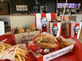 Ayutthaya,Thailand - Apr 06,2022- KFC Hamburger and Fried Chicken set at fast food restaurant Kentucky Fried Chicken KFC is a large restaurant chain. At Big C, Wangnoi branch in Thailand - Asia. photo