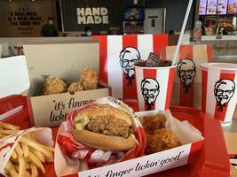 Ayutthaya,Thailand - Apr 06,2022- KFC Hamburger and Fried Chicken set at fast food restaurant Kentucky Fried Chicken KFC is a large restaurant chain. At Big C, Wangnoi branch in Thailand - Asia. photo