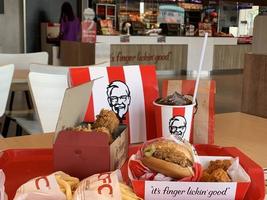 Ayutthaya,Thailand - Apr 06,2022- KFC Hamburger and Fried Chicken set at fast food restaurant Kentucky Fried Chicken KFC is a large restaurant chain. At Big C, Wangnoi branch in Thailand - Asia. photo