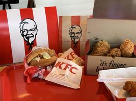 Ayutthaya,Thailand - Apr 06,2022- KFC Hamburger and Fried Chicken set at fast food restaurant Kentucky Fried Chicken KFC is a large restaurant chain. At Big C, Wangnoi branch in Thailand - Asia. photo