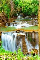 Amazing colorful waterfall in national park forest during spring,beautiful deep forest in Thailand,technic long exposure, during vacation and relax time. photo