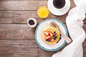 Breakfast waffles with fresh berries photo