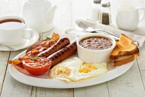 Full english breakfast with egg and bacon photo