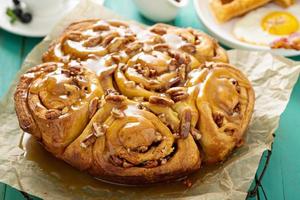 Sticky pecan buns on breakfast table photo