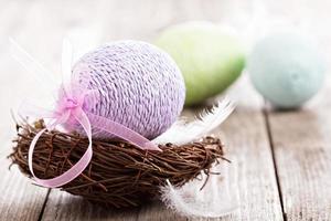 Decorative Easter egg in a nest photo