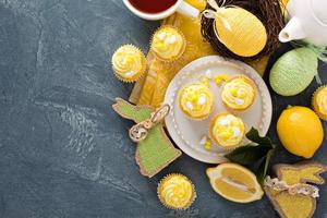 Easter background with lemon cupcakes photo