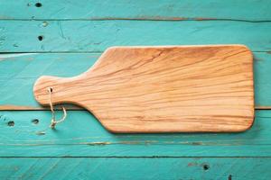 Wooden rustic background with a cutting board photo