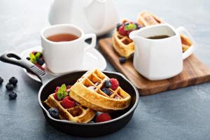 Freshly baked waffles with berries for breakfast photo