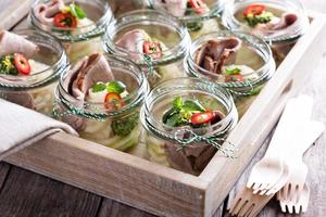Roastbeef with mashed potatoes in small jars photo