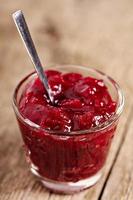 Homemade cranberry sauce in a glass, holiday recipe photo