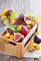 Exotic fruits in a wooden crate photo