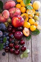 Summer fruits on wooden table photo