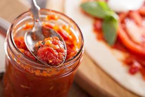 Pizza sauce in a jar photo